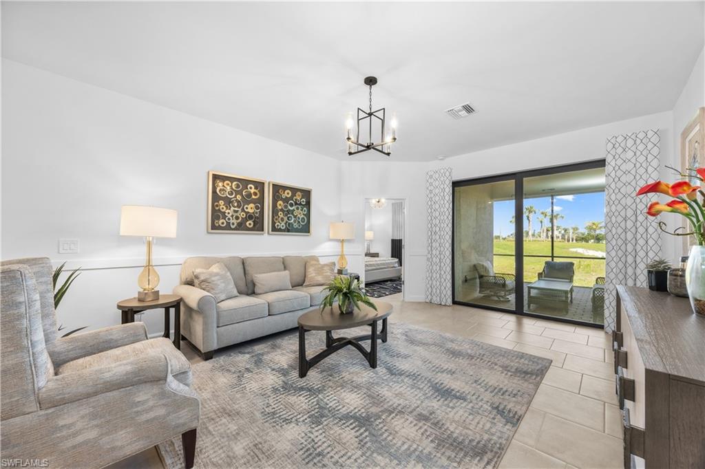 14656 Ballast Way Alva, FL 33920 - Photo 6 of 30 a living room with furniture and a chandelier