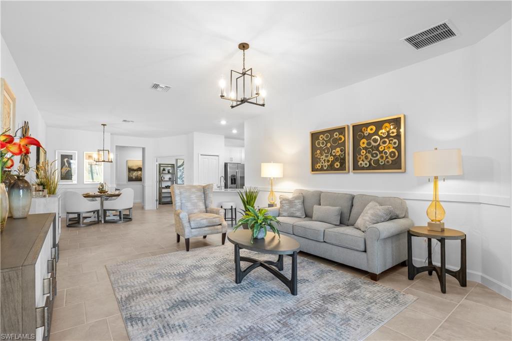 14656 Ballast Way Alva, FL 33920 - Photo 8 of 30 a living room with furniture and wooden floor