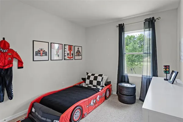 a bed room with furniture and a window