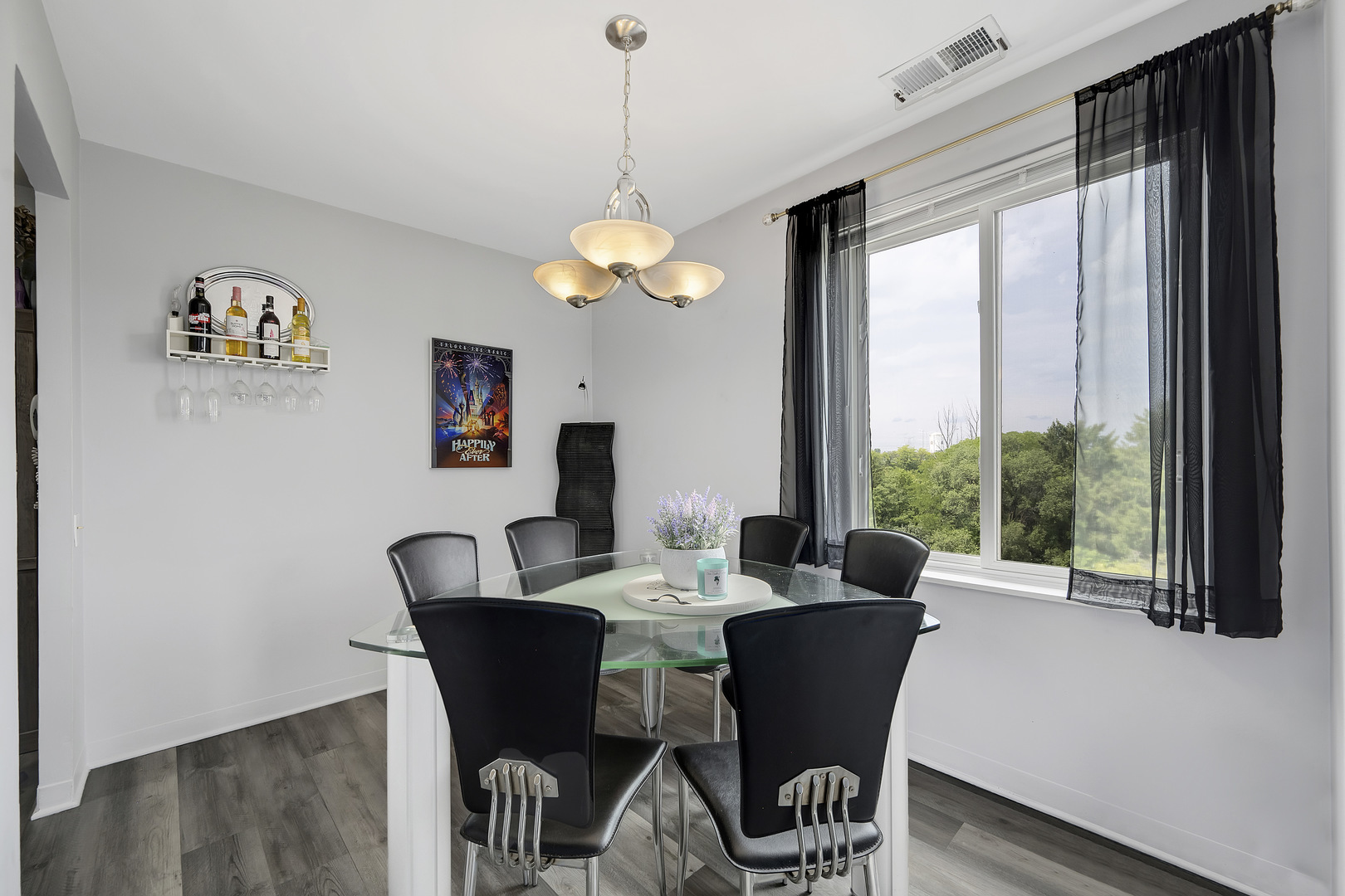 420 Walnut Creek Road, Unit 3406 Lisle, IL 60532 - Photo 11 of 21 a view of a dining room with furniture a chandelier and large windows