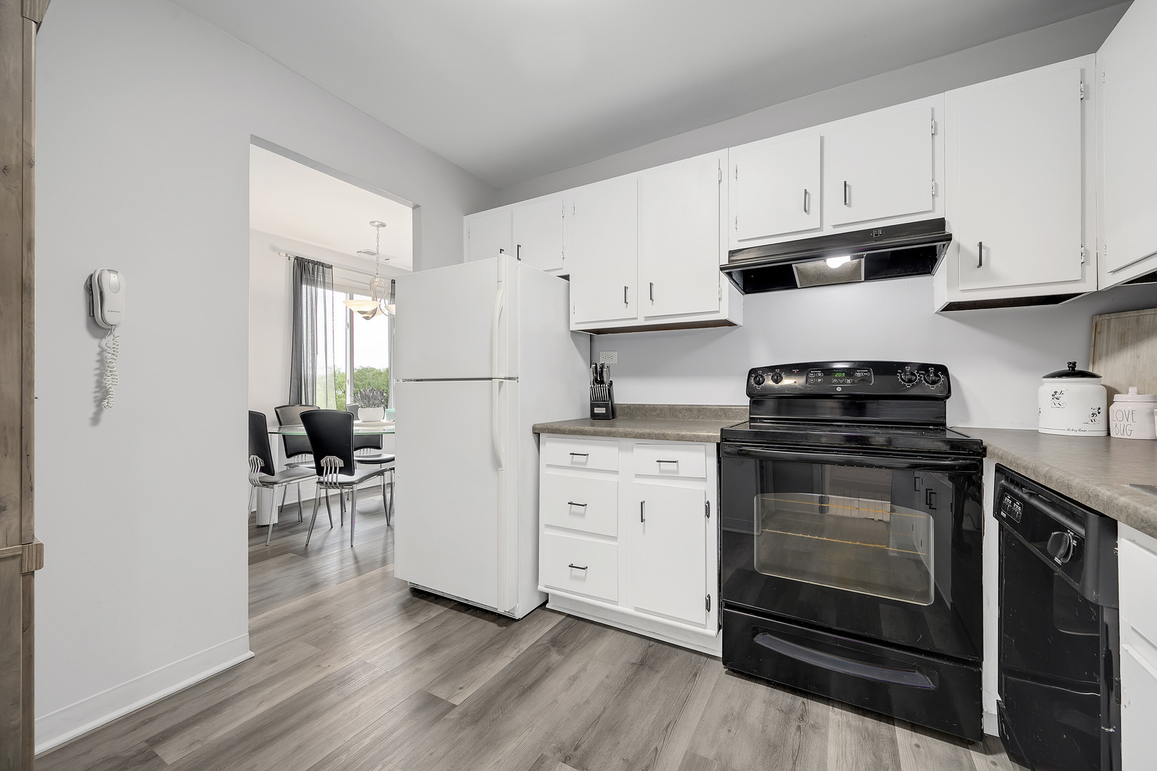 420 Walnut Creek Road, Unit 3406 Lisle, IL 60532 - Photo 9 of 21 a kitchen with granite countertop white cabinets and appliances