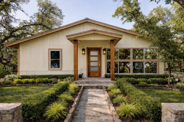a front view of a house with garden