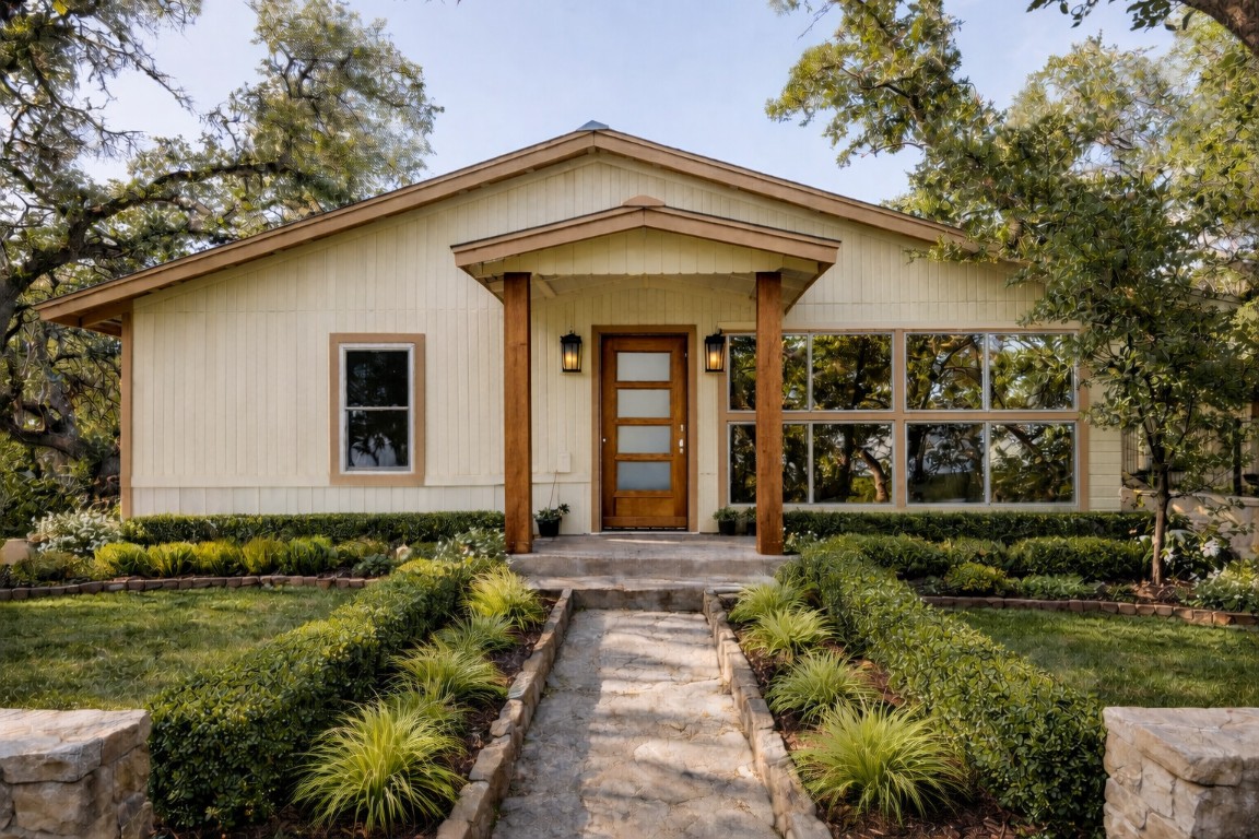 a front view of a house with garden