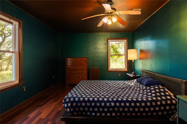 a bathroom with a sink a toilet a mirror and vanity