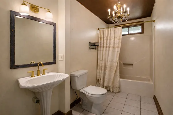 a bathroom with a bathtub and shower