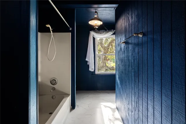 a view of house with backyard