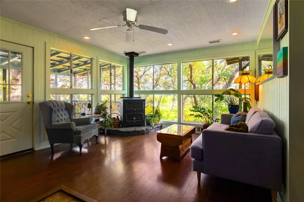 a kitchen with stainless steel appliances granite countertop a stove a cabinets and a window