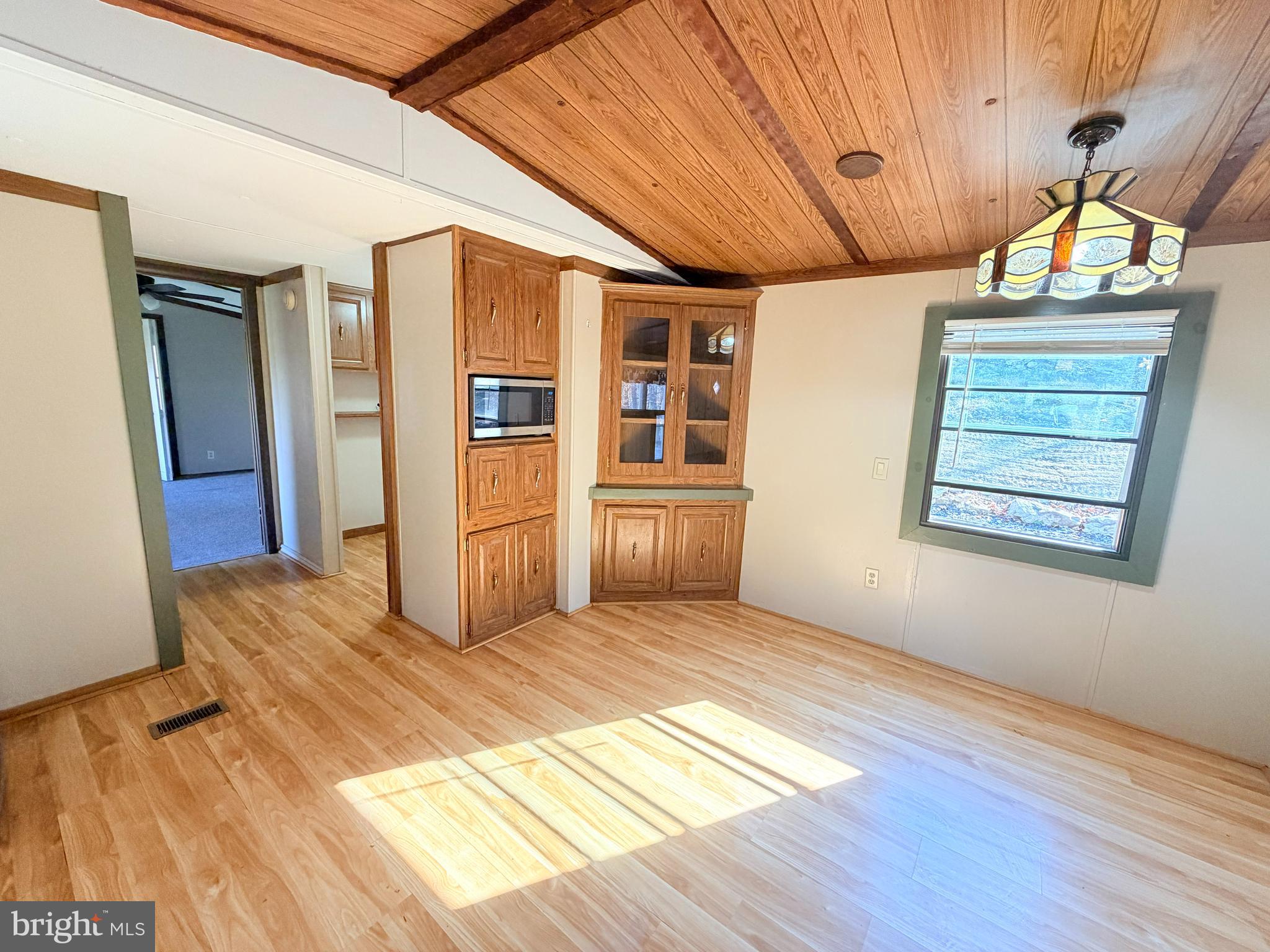 453 Upper Bailey Road Newport, PA 17074 - Photo 13 of 31 a view of an empty room with window and wooden floor