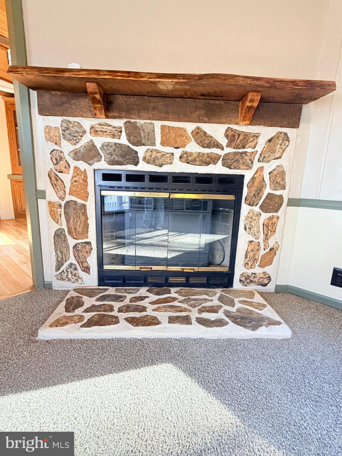 453 Upper Bailey Road Newport, PA 17074 - Photo 16 of 31 a view of an empty room with wooden floor and a fireplace