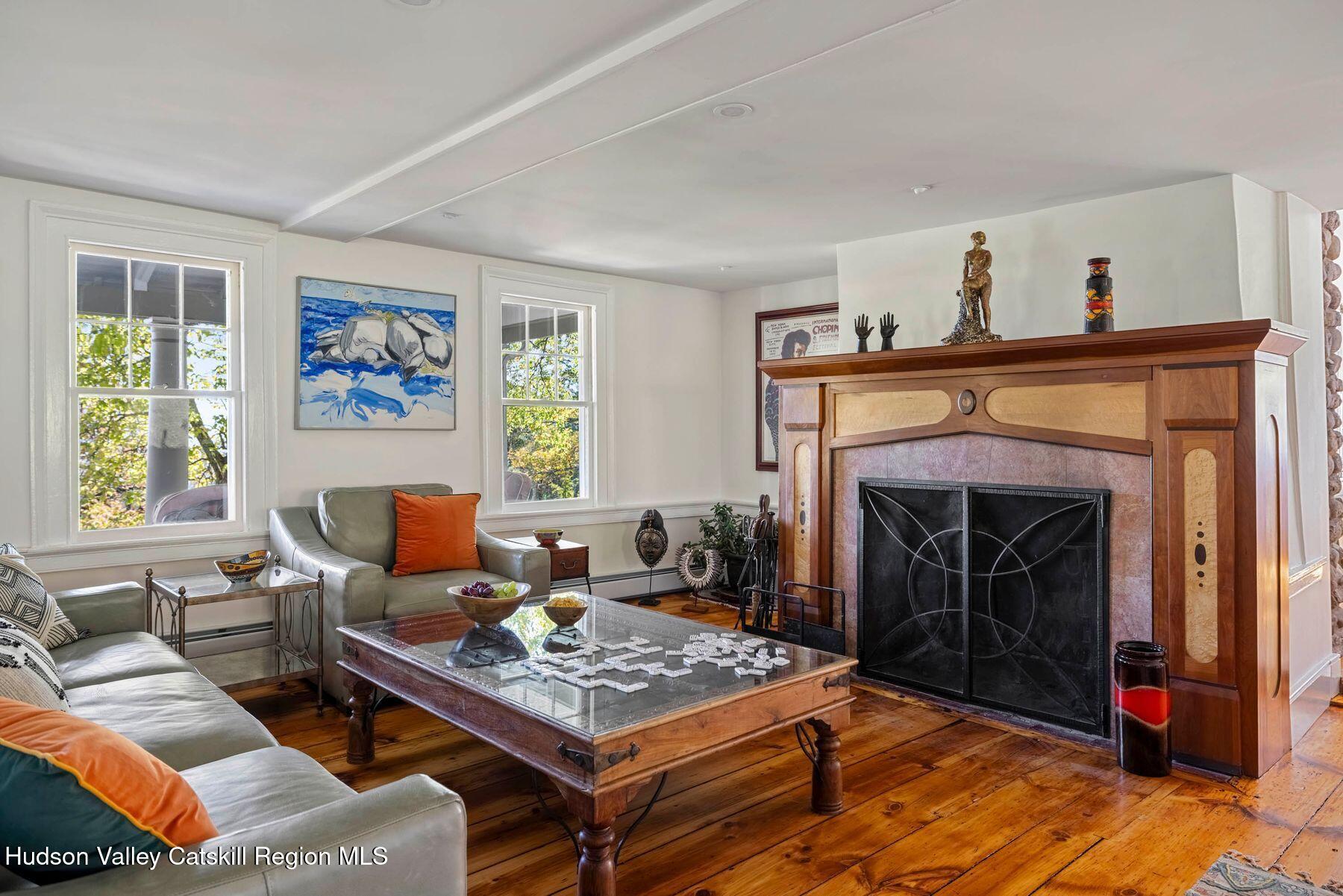 114 Chase Road Shokan, NY 12481 - Photo 13 of 68 a living room with furniture and a fireplace