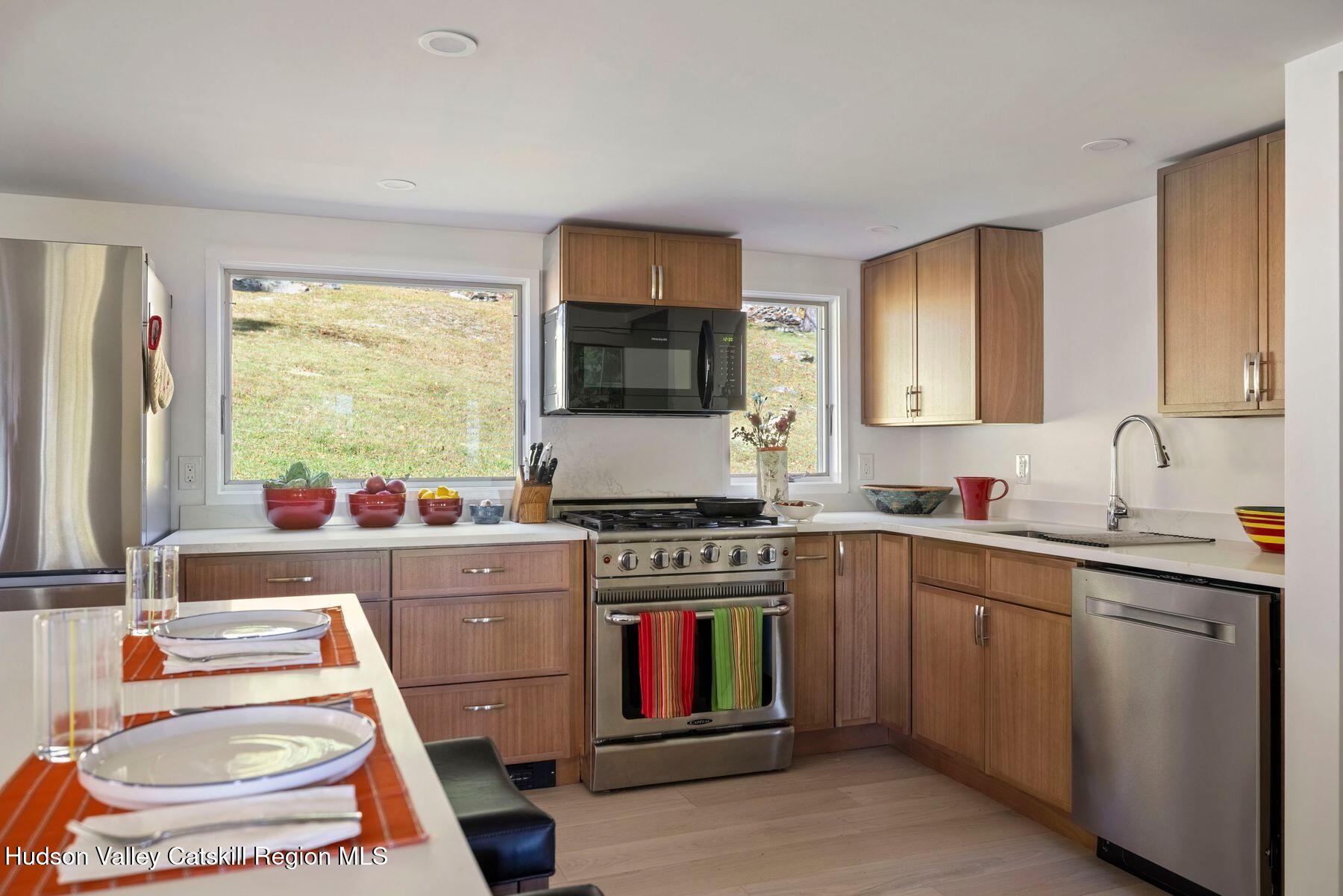 114 Chase Road Shokan, NY 12481 - Photo 19 of 68 a kitchen with a stove a sink and a window