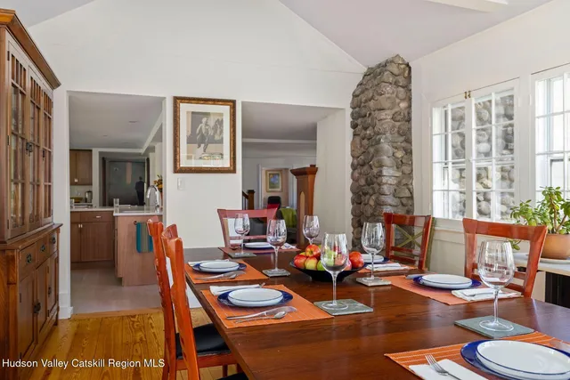 a living room filled with furniture and a large window