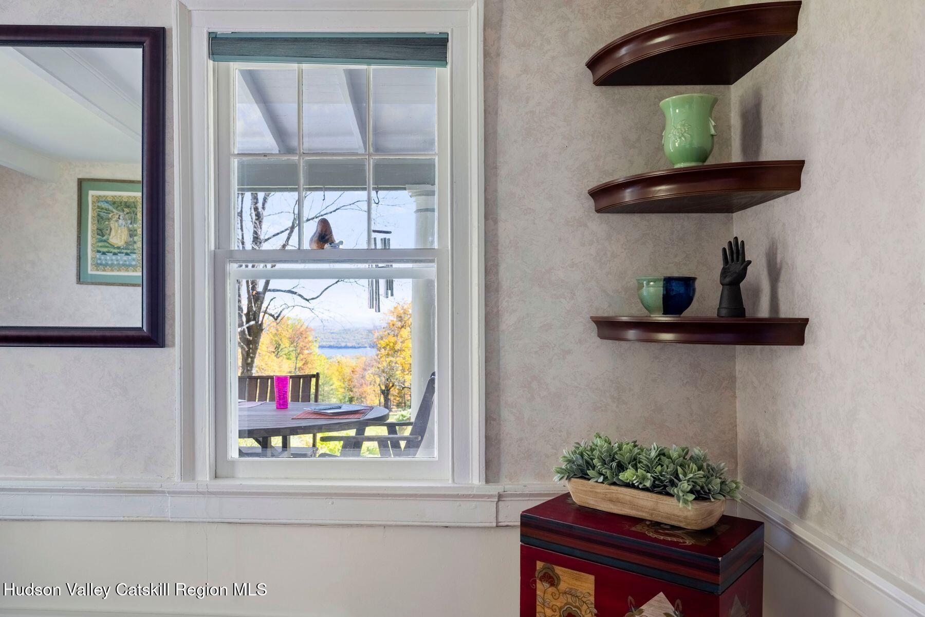 114 Chase Road Shokan, NY 12481 - Photo 25 of 68 a room with a table and a potted plant