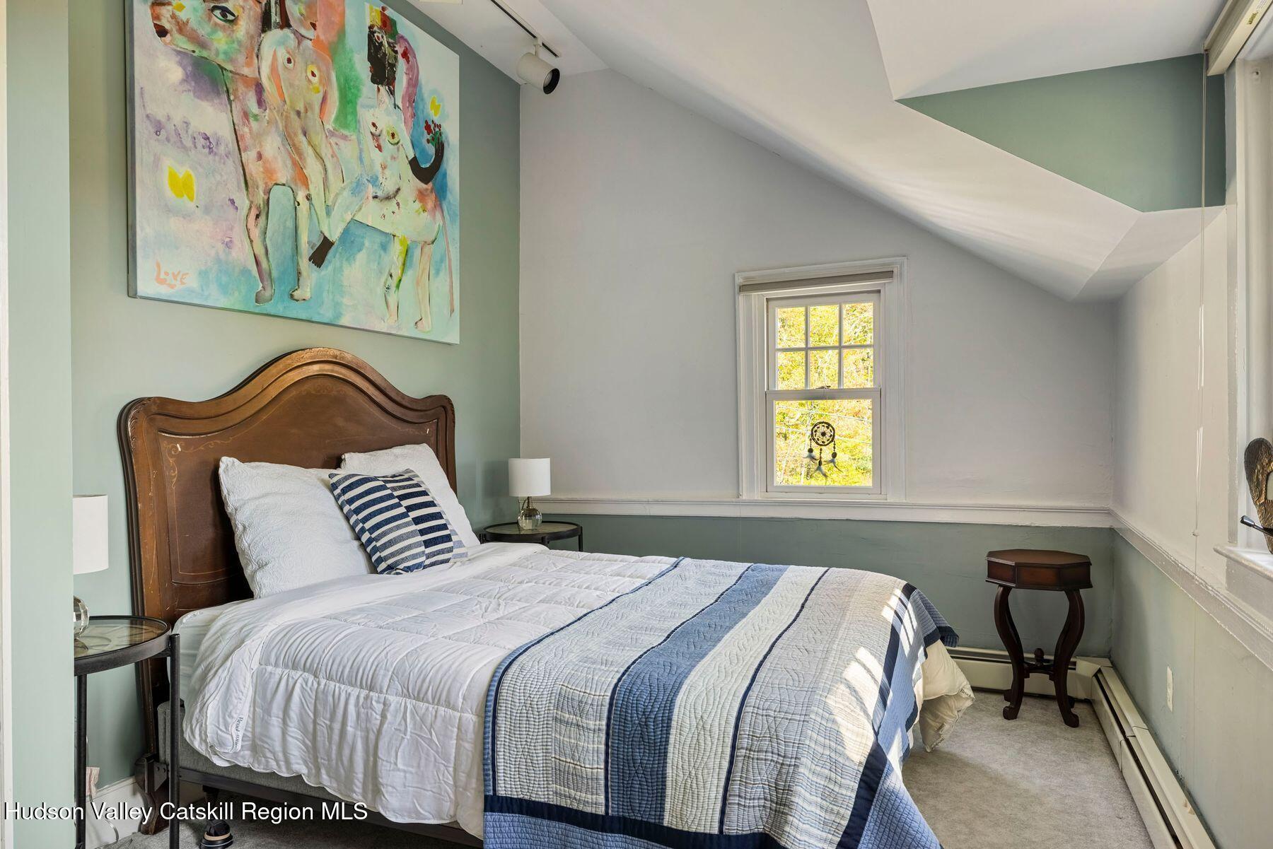 114 Chase Road Shokan, NY 12481 - Photo 41 of 68 a bedroom with a bed and painting on the wall