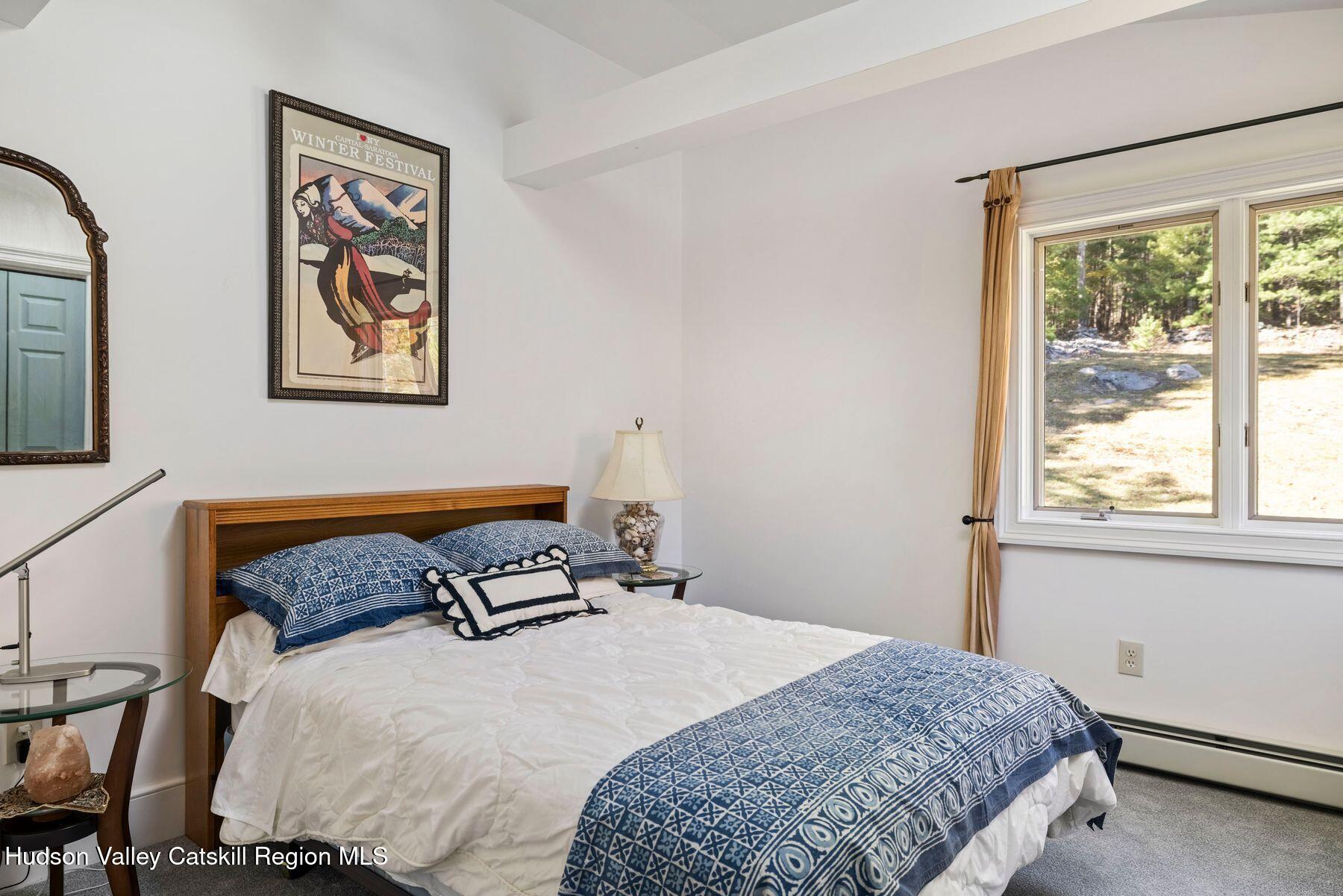 114 Chase Road Shokan, NY 12481 - Photo 44 of 68 a bedroom with a bed and wooden floor