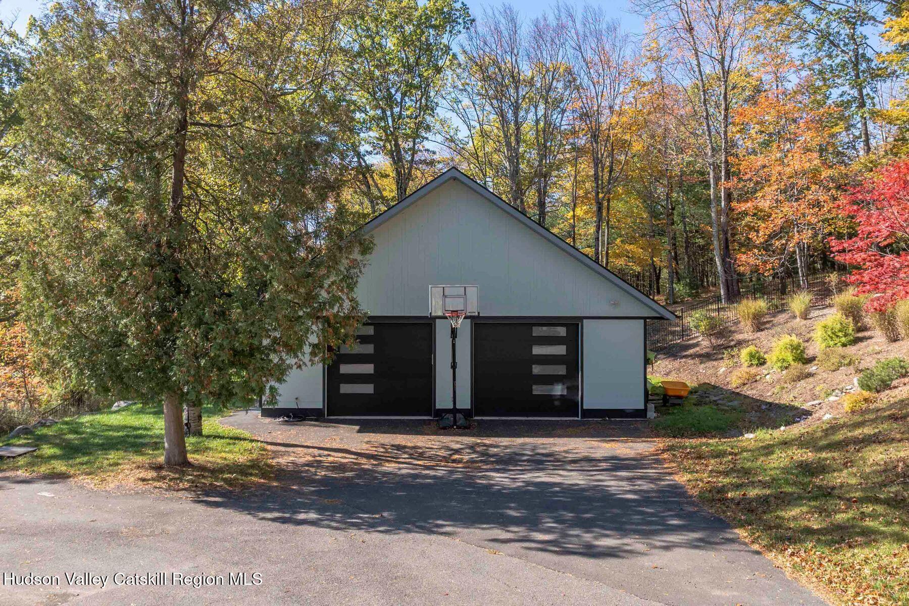 114 Chase Road Shokan, NY 12481 - Photo 55 of 68 a view of a wooden house with a large tree