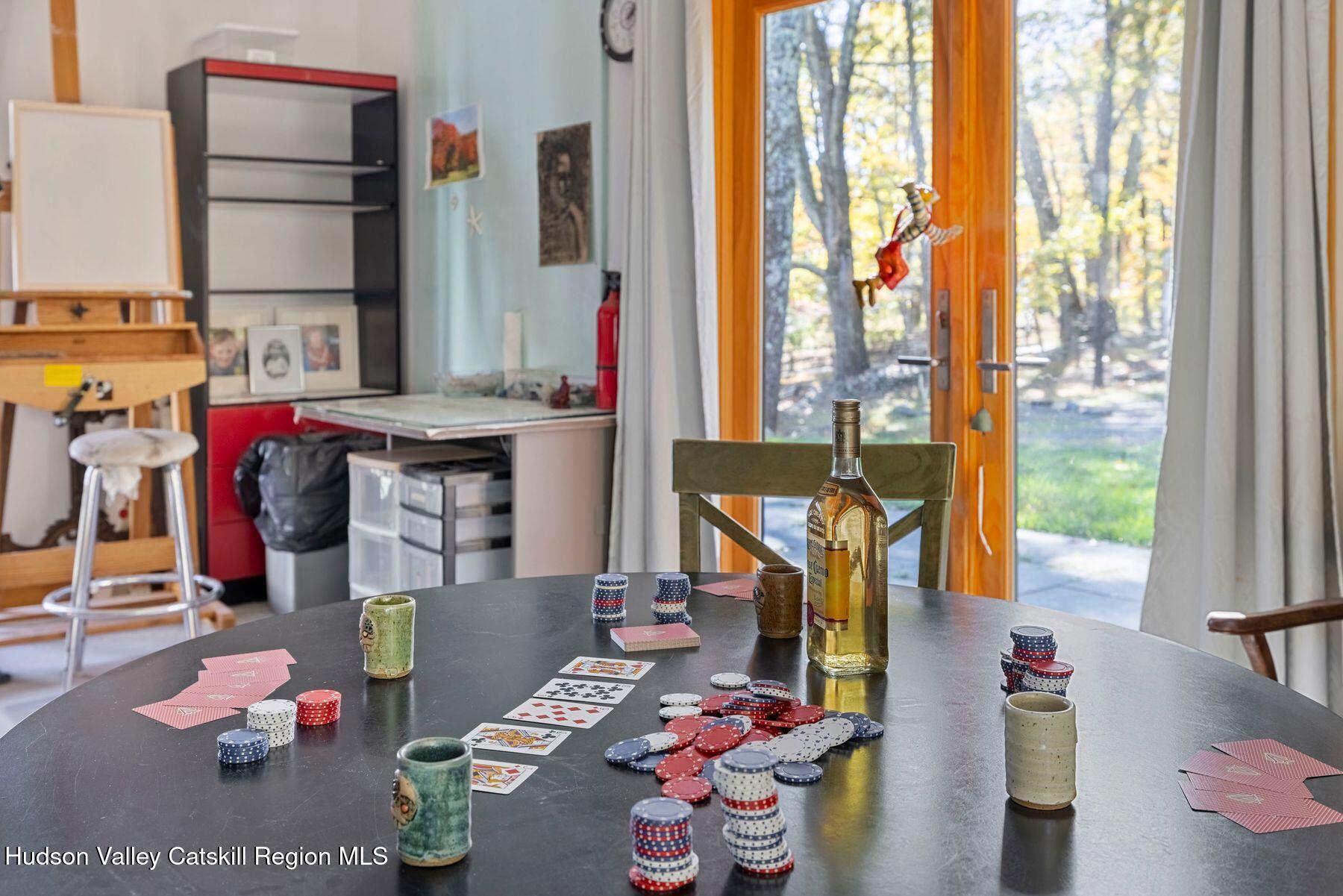 114 Chase Road Shokan, NY 12481 - Photo 57 of 68 a living room with furniture and a floor to ceiling window