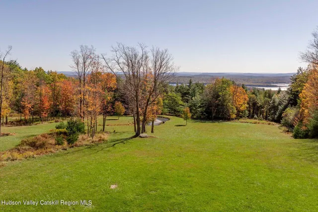 a living room with furniture and stairs