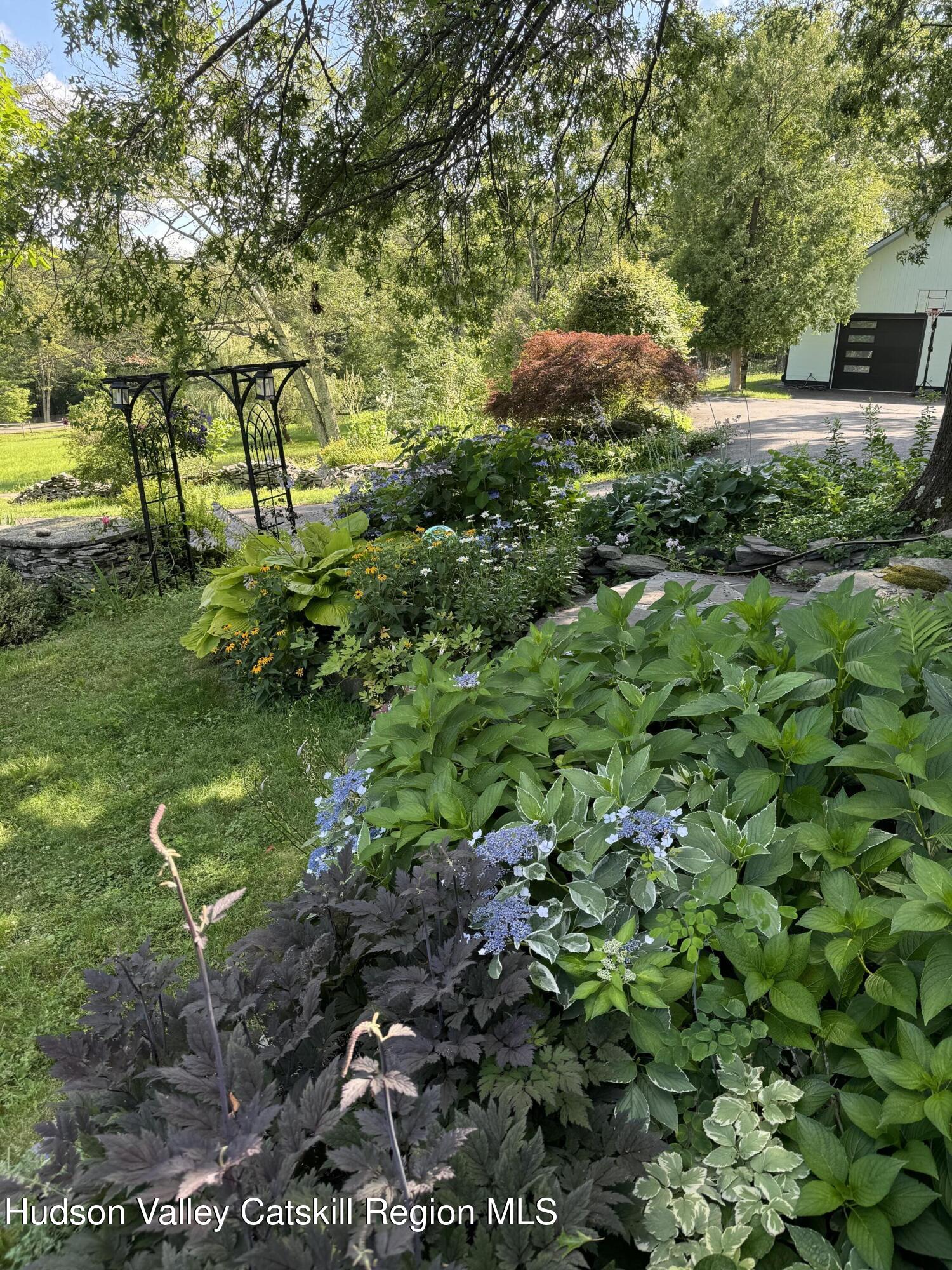 114 Chase Road Shokan, NY 12481 - Photo 64 of 68 a view of a garden with a tree