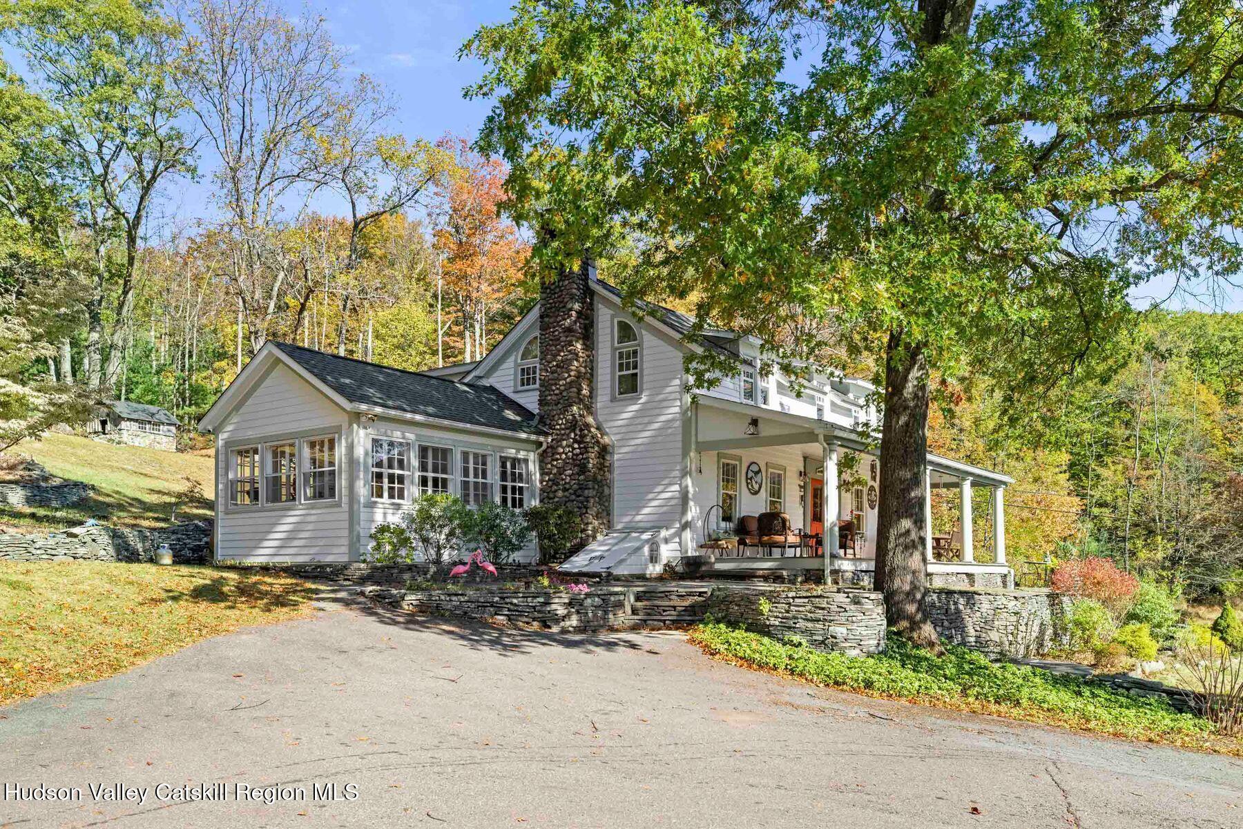 114 Chase Road Shokan, NY 12481 - Photo 9 of 68 a front view of a house with a yard and trees