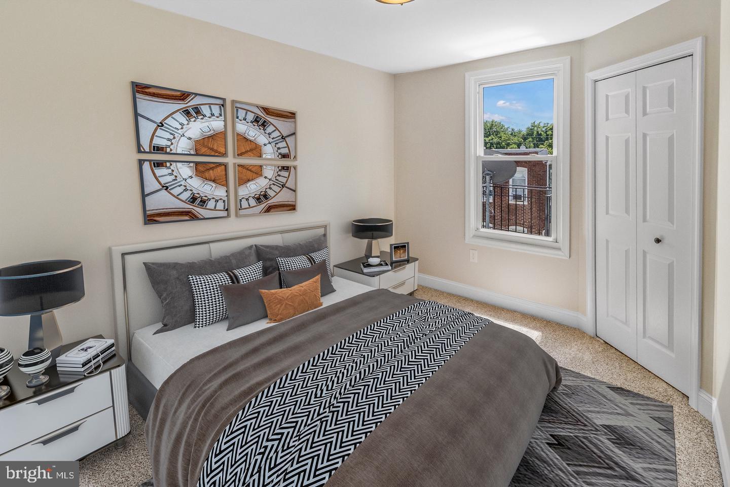 4206 Reisterstown Road Baltimore, MD 21215 - Photo 11 of 14 a bedroom with a bed and a window