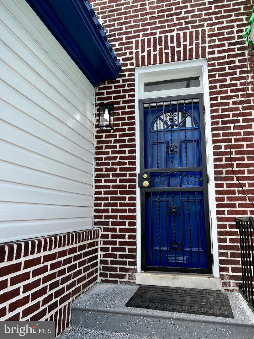 4206 Reisterstown Road Baltimore, MD 21215 - Photo 5 of 14 a view of front door of house