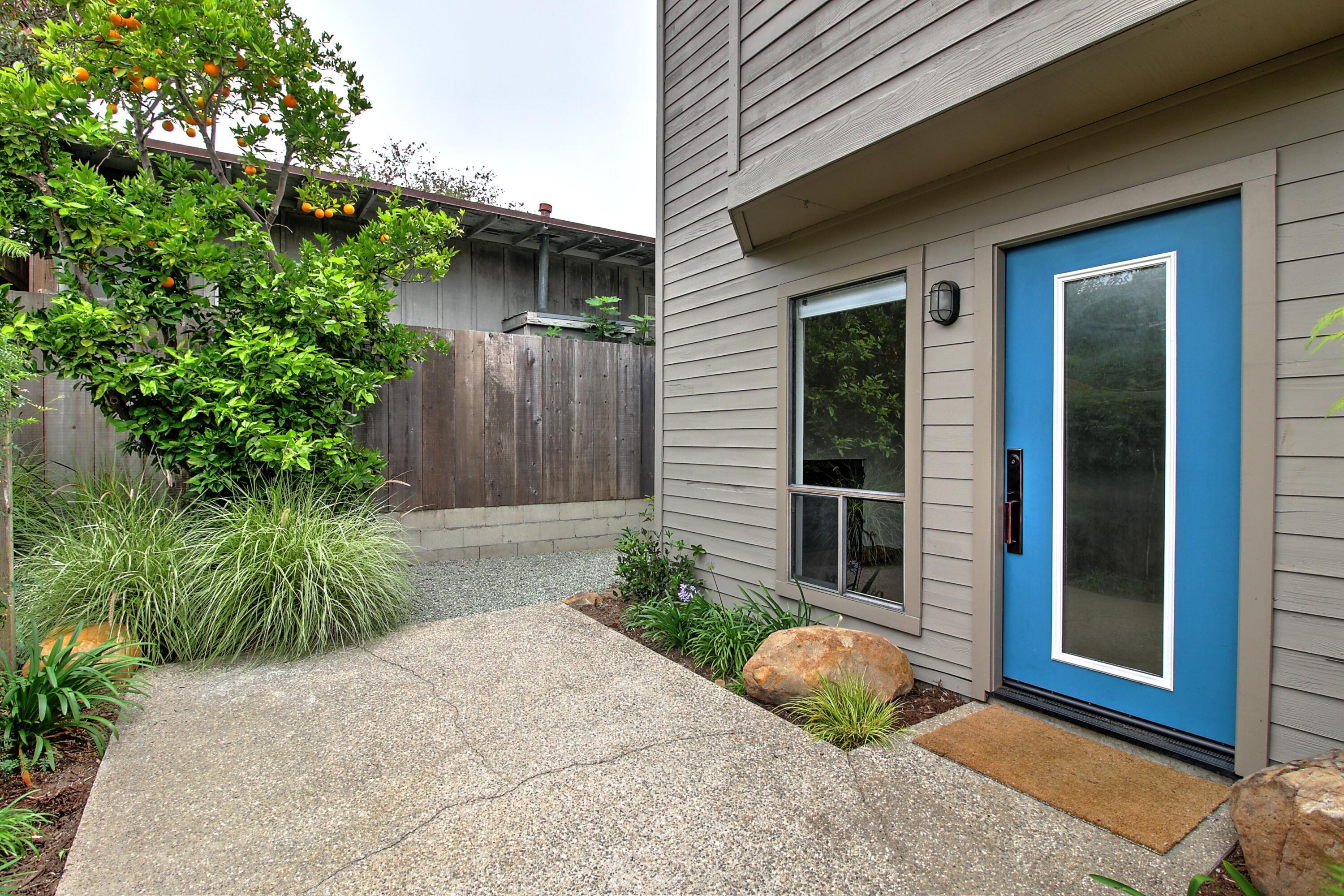 a front view of a house with garden
