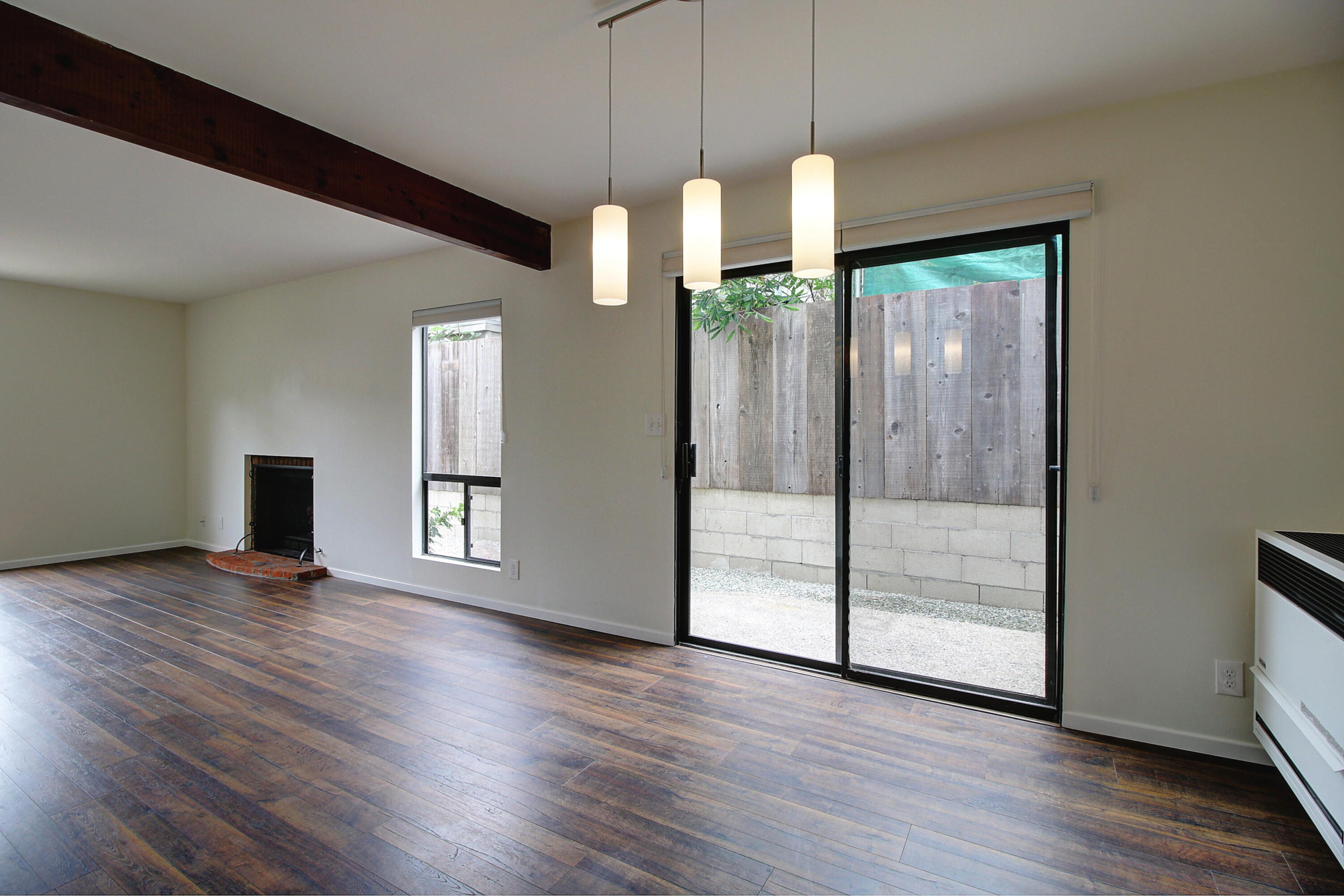 1624 Bath Street, Unit B Santa Barbara, CA 93101 - Photo 5 of 16 a view of empty room with wooden floor and fan
