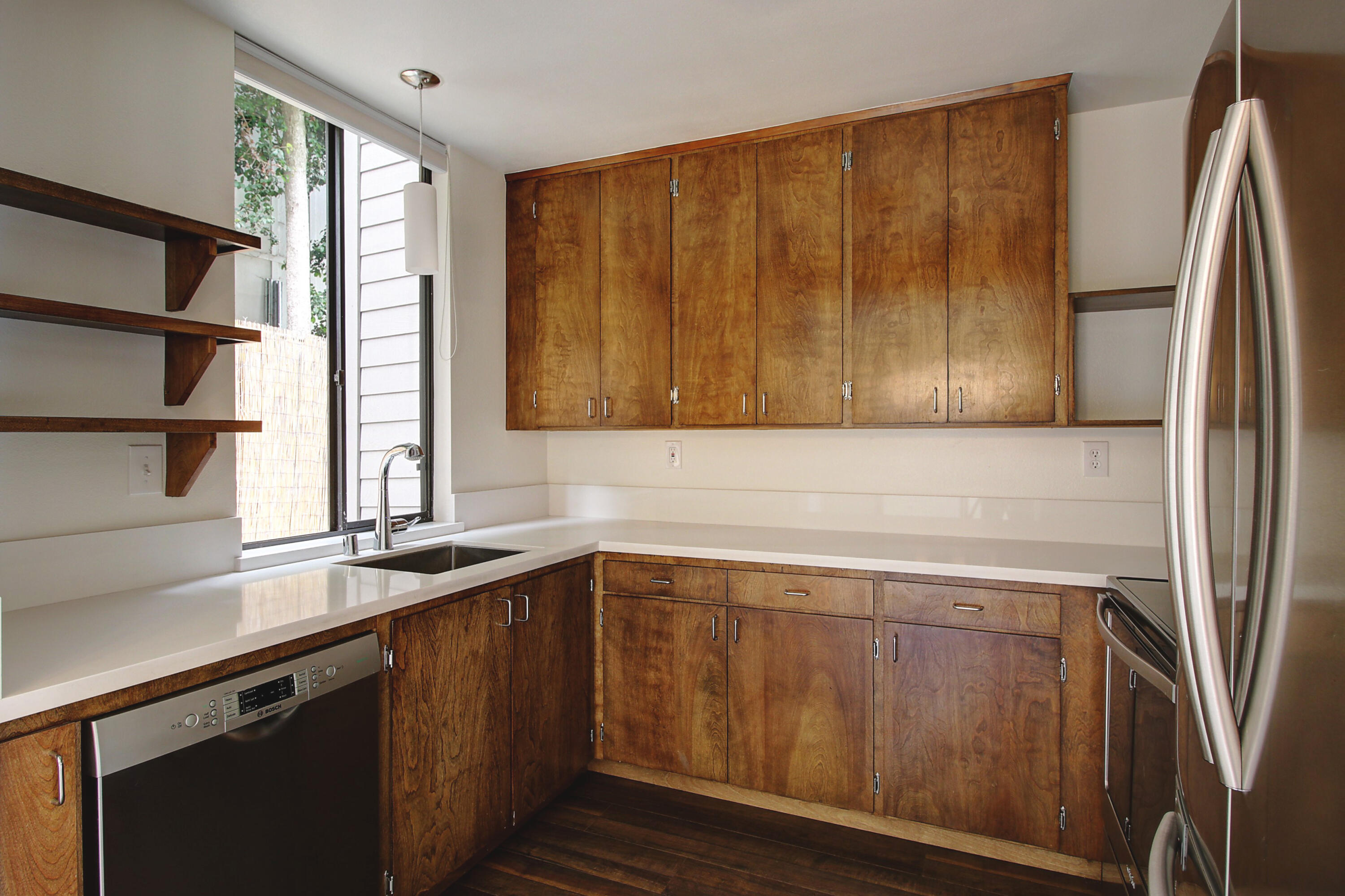1624 Bath Street, Unit B Santa Barbara, CA 93101 - Photo 8 of 16 a view of a kitchen with wooden floor and a window
