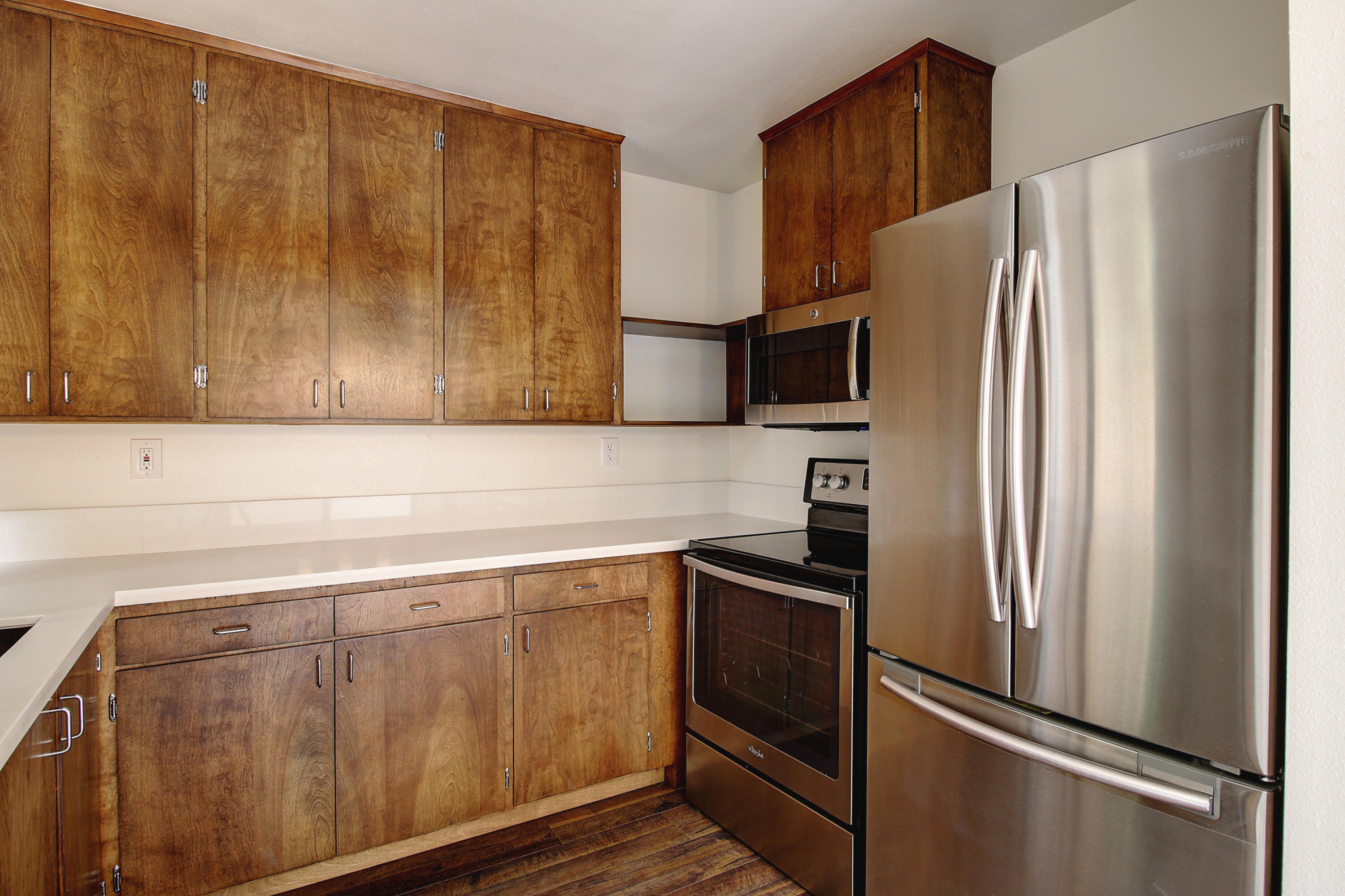 1624 Bath Street, Unit B Santa Barbara, CA 93101 - Photo 9 of 16 a kitchen with stainless steel appliances granite countertop a refrigerator and a sink