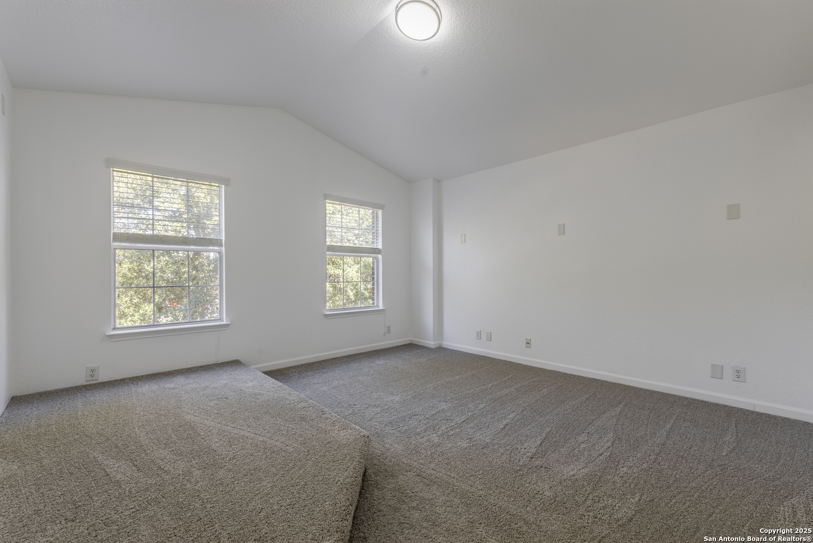 105 Lookout View Cibolo, TX 78108 - Photo 14 of 26 an empty room with windows