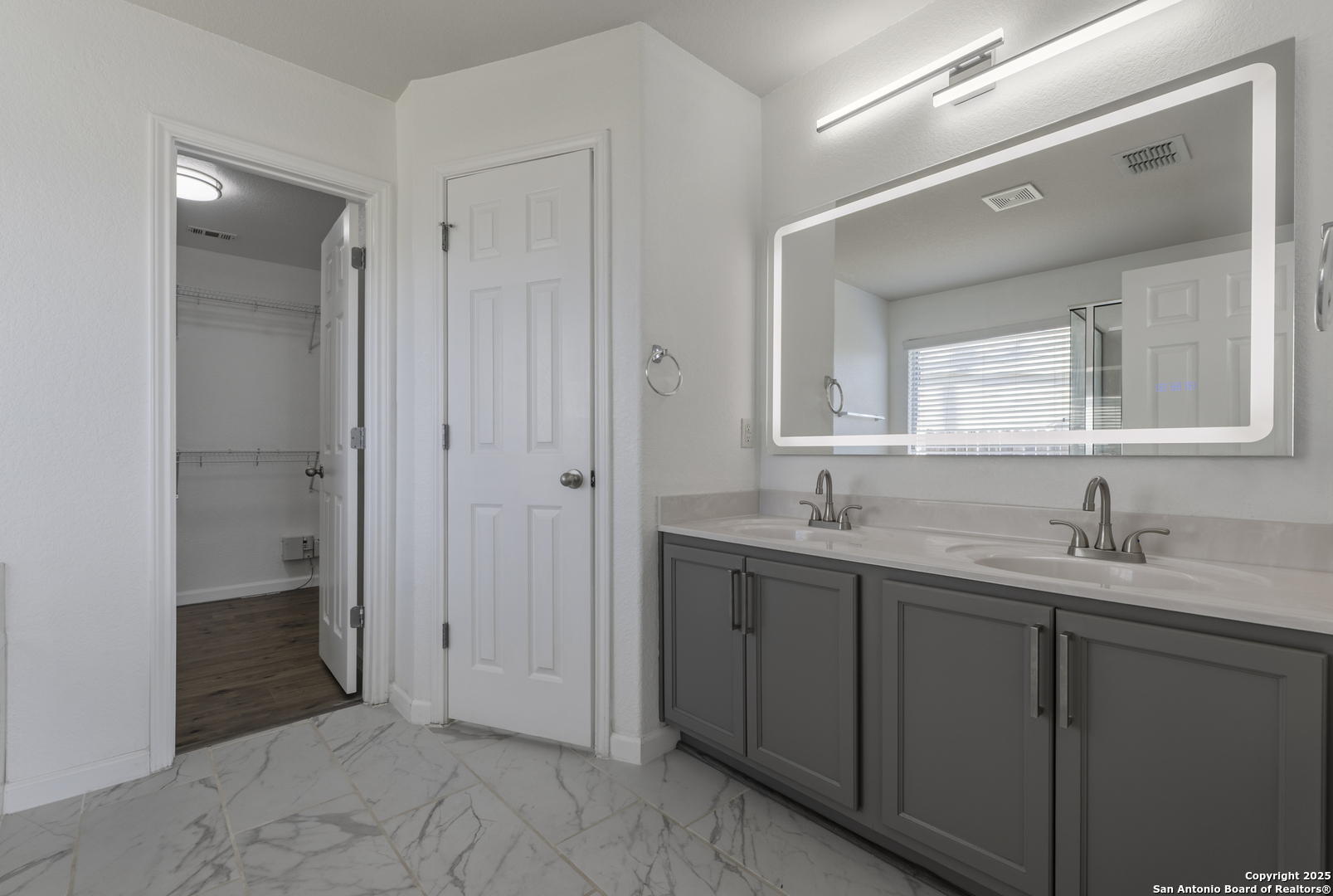 105 Lookout View Cibolo, TX 78108 - Photo 20 of 26 a bathroom with a granite countertop sink mirror and a