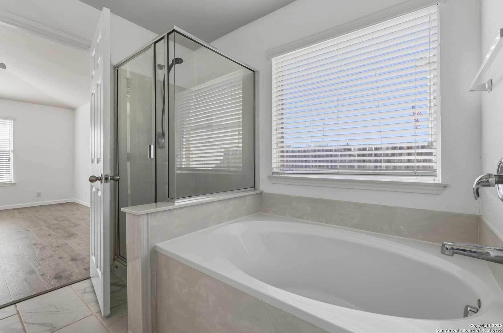 105 Lookout View Cibolo, TX 78108 - Photo 21 of 26 a bathroom with a bathtub and a shower