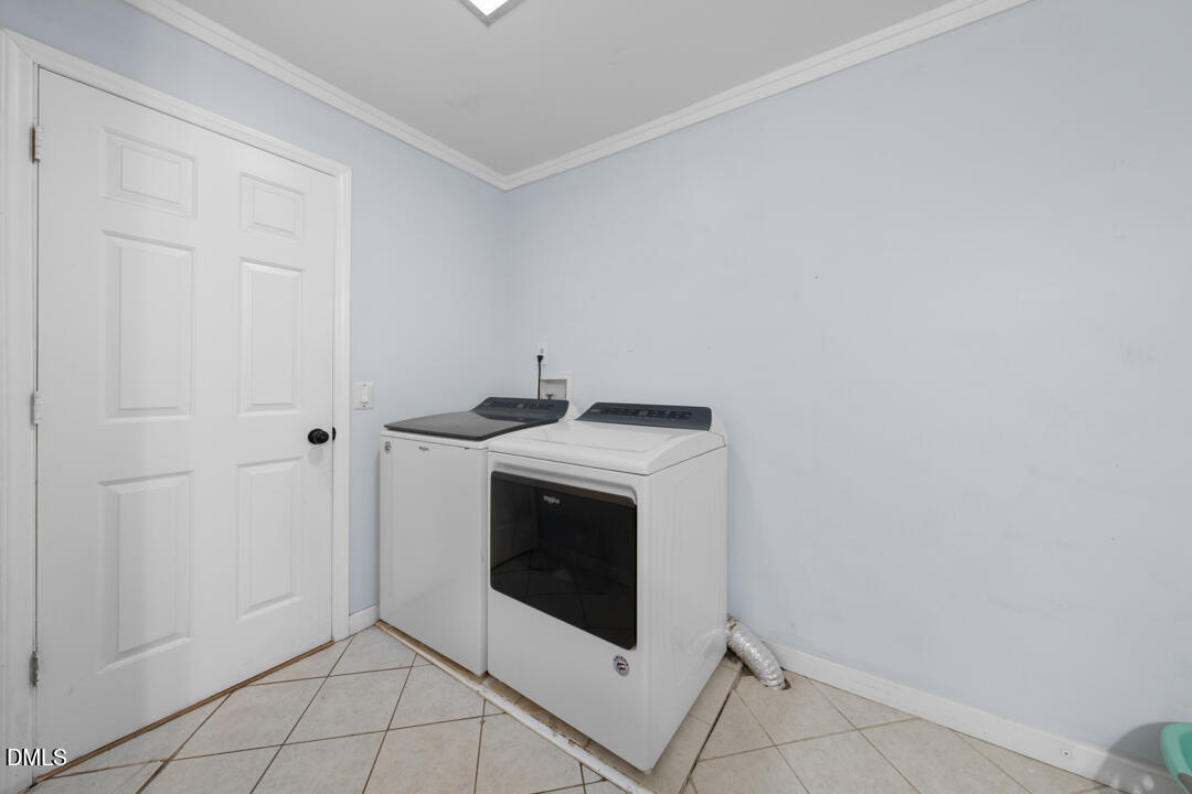 4739 Wild Azalea Place Rougemont, NC 27572 - Photo 26 of 48 a utility room with dryer and washer