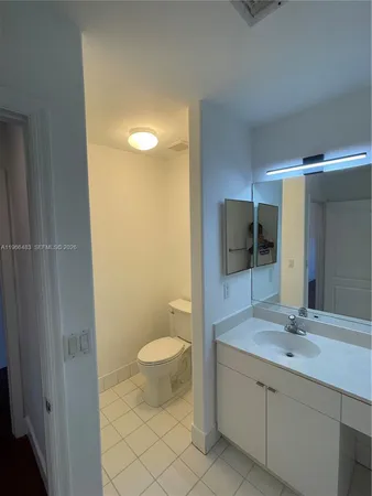 a room with a sink and cabinets
