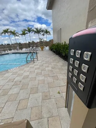 a swimming pool with outdoor seating
