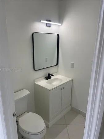 a bathroom with a sink and washing machine