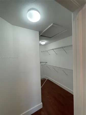 a bathroom with a shower sink and mirror