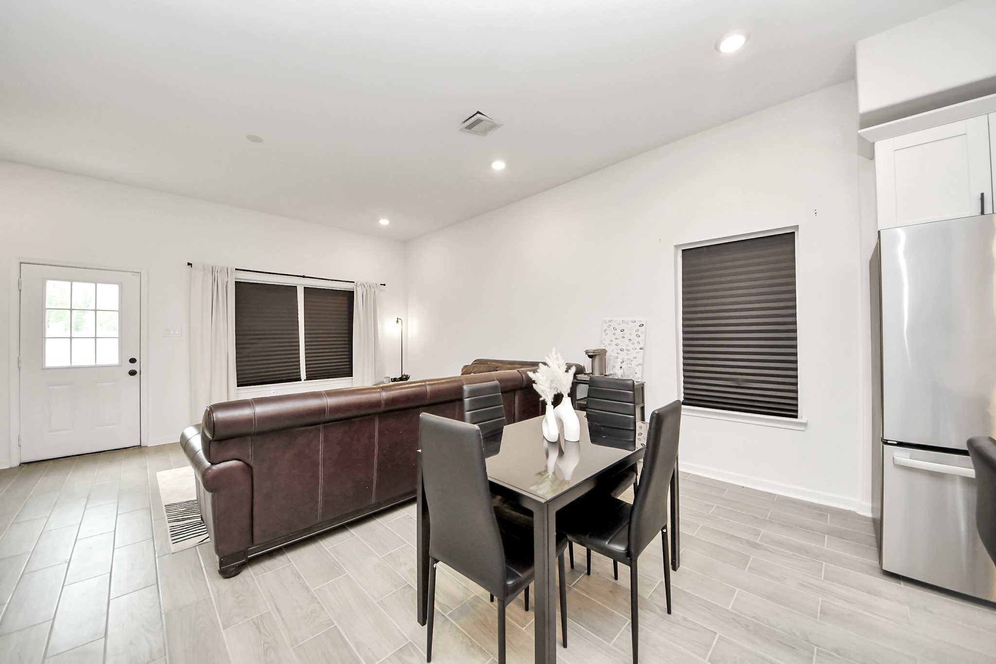 4613 Ireland Street, Unit B Houston, TX 77016 - Photo 16 of 39 a living room with furniture and a wooden floor