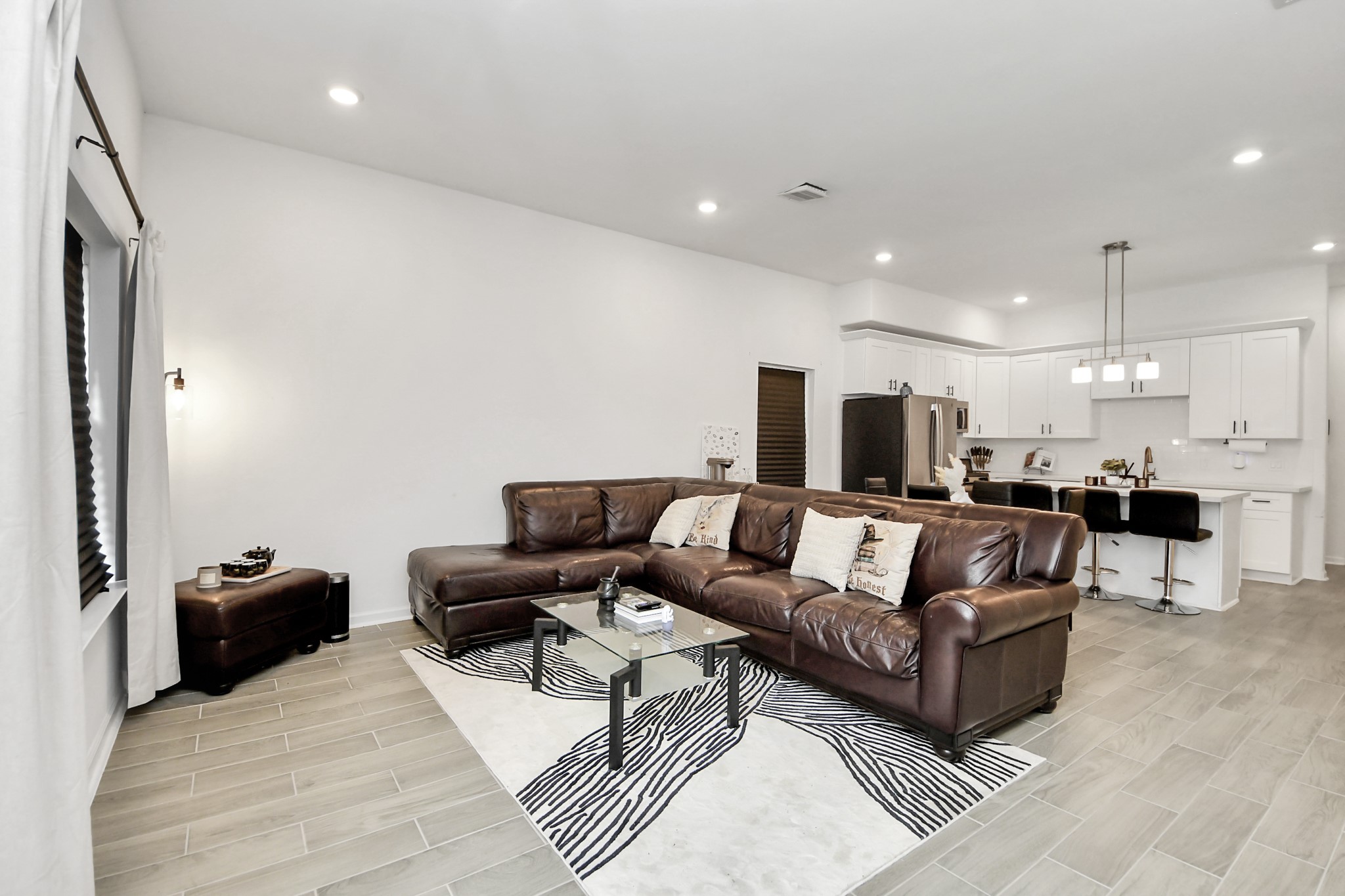 4613 Ireland Street, Unit B Houston, TX 77016 - Photo 20 of 39 a living room with furniture kitchen area and a couch