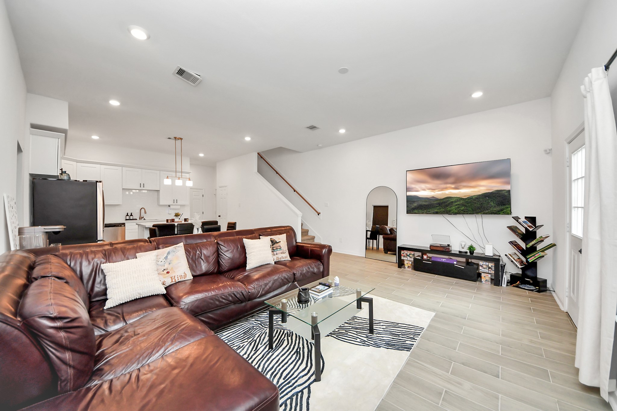 4613 Ireland Street, Unit B Houston, TX 77016 - Photo 21 of 39 a living room with furniture and a flat screen tv
