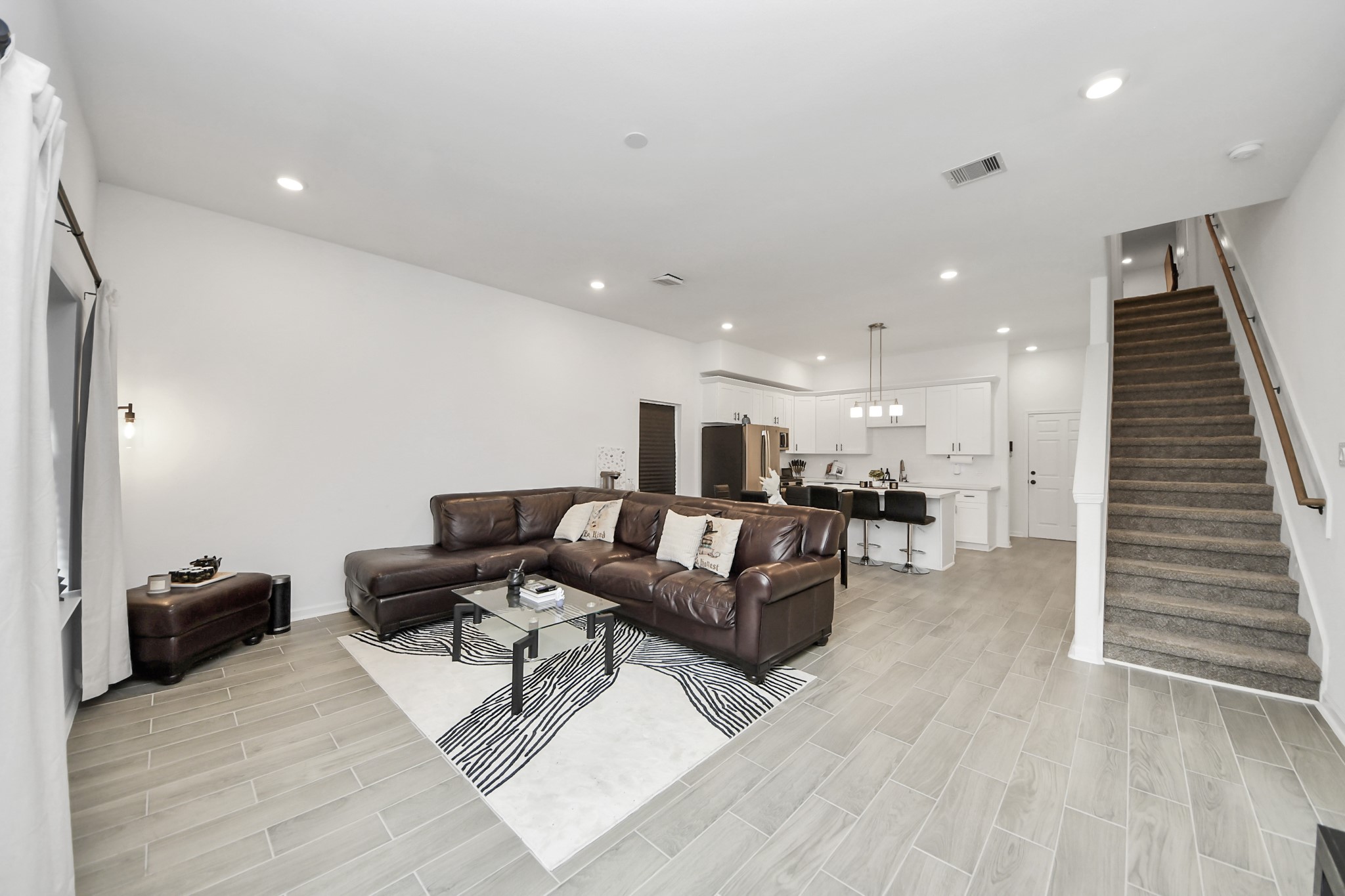 4613 Ireland Street, Unit B Houston, TX 77016 - Photo 22 of 39 a living room with furniture and a wooden floor