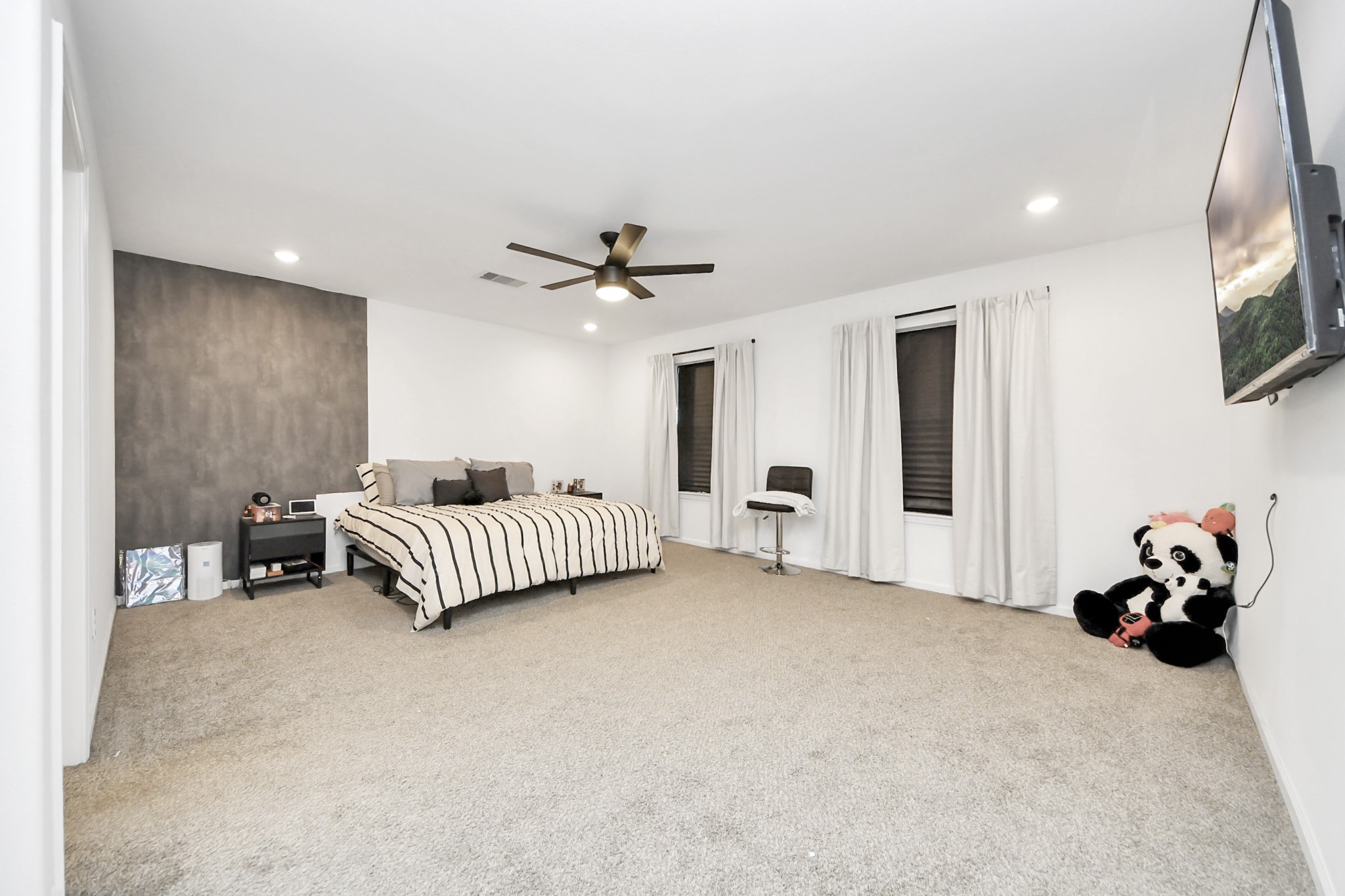 4613 Ireland Street, Unit B Houston, TX 77016 - Photo 23 of 39 a bedroom with furniture and a chandelier