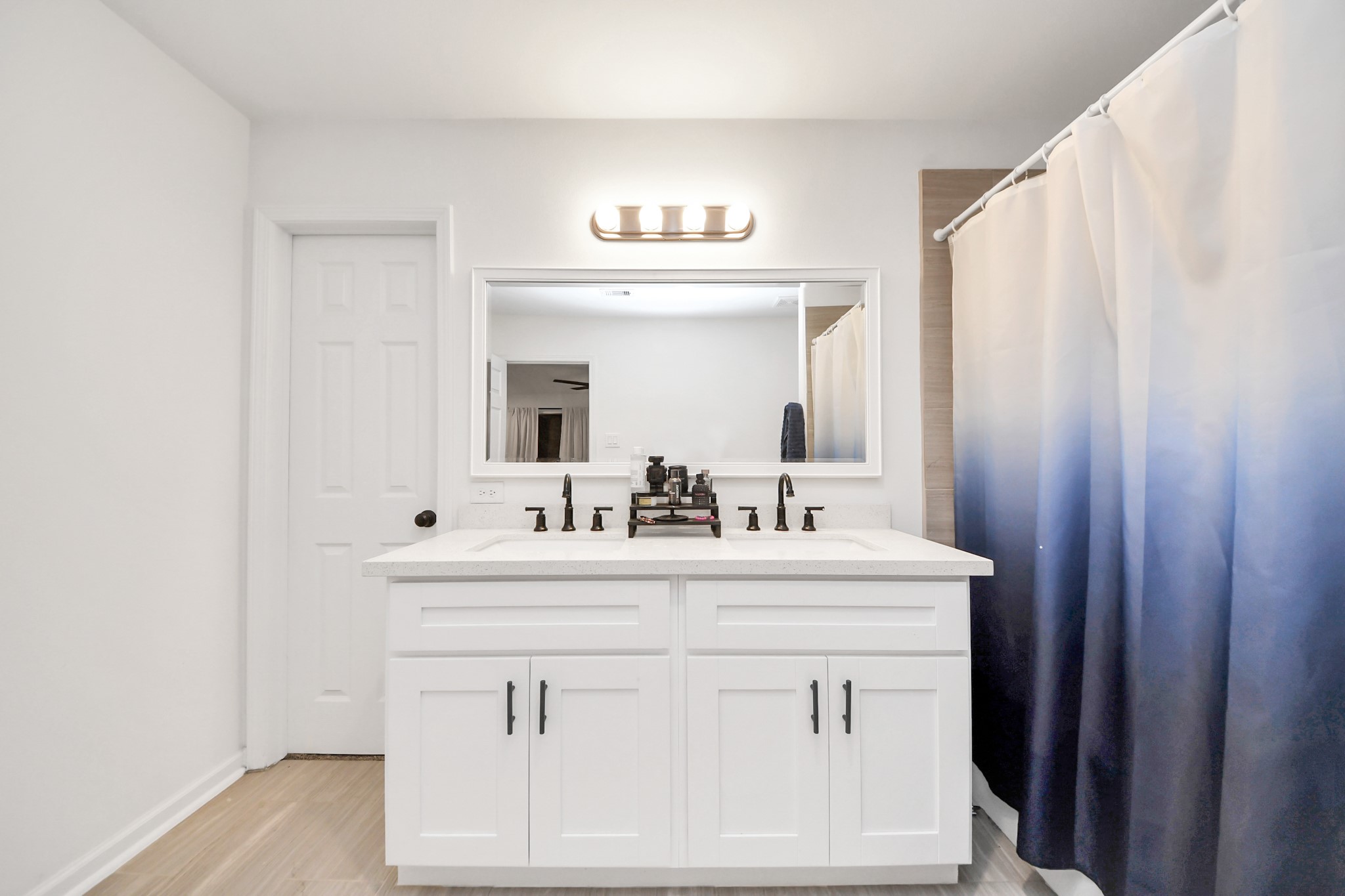 4613 Ireland Street, Unit B Houston, TX 77016 - Photo 27 of 39 a bathroom with a sink and a mirror