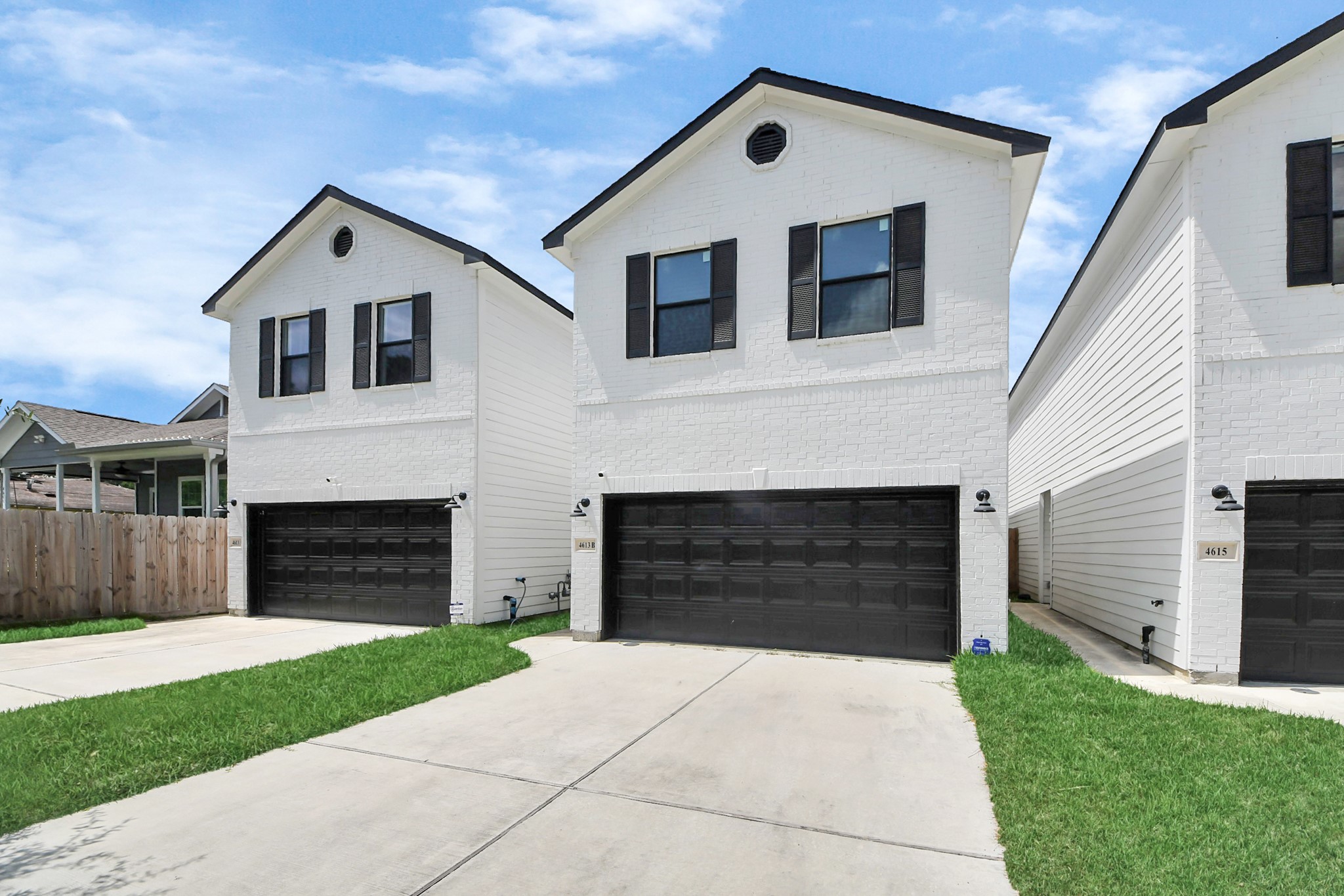 4613 Ireland Street, Unit B Houston, TX 77016 - Photo 39 of 39 a front view of a house with a yard and garage