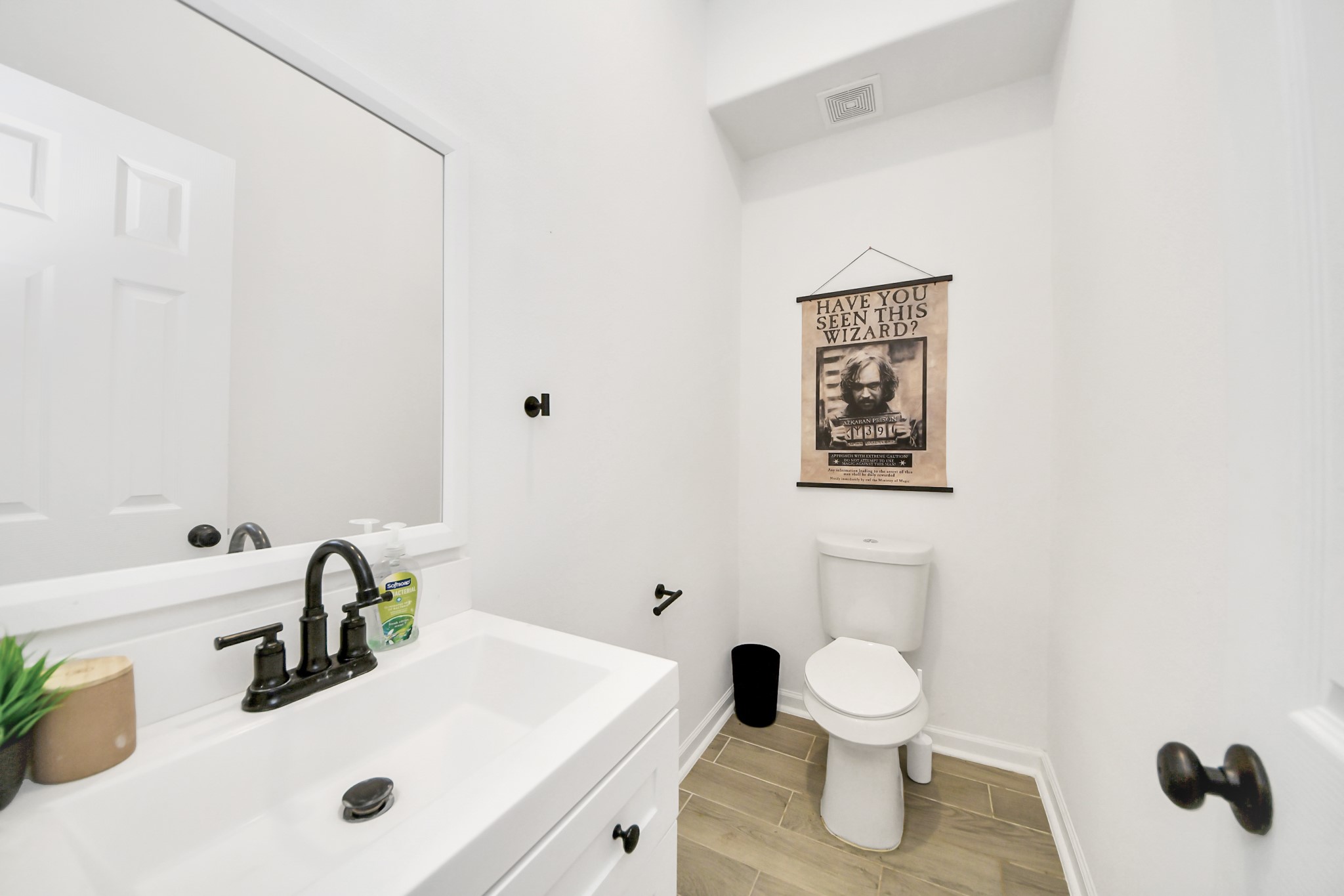 4613 Ireland Street, Unit B Houston, TX 77016 - Photo 4 of 39 a bathroom with a sink toilet and a mirror
