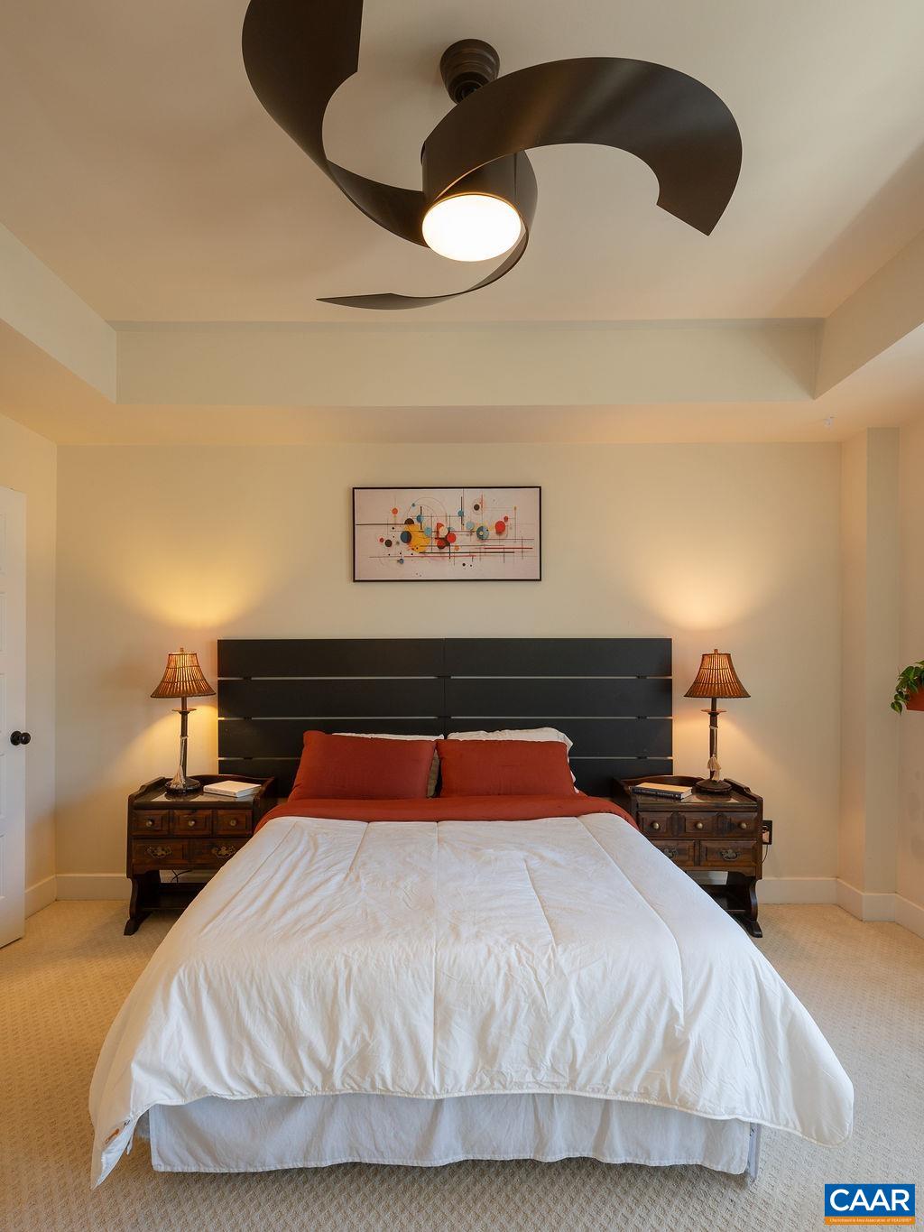 2052 Avinity Loop Charlottesville, VA 22902 - Photo 13 of 39 a bedroom with a bed and a lamp