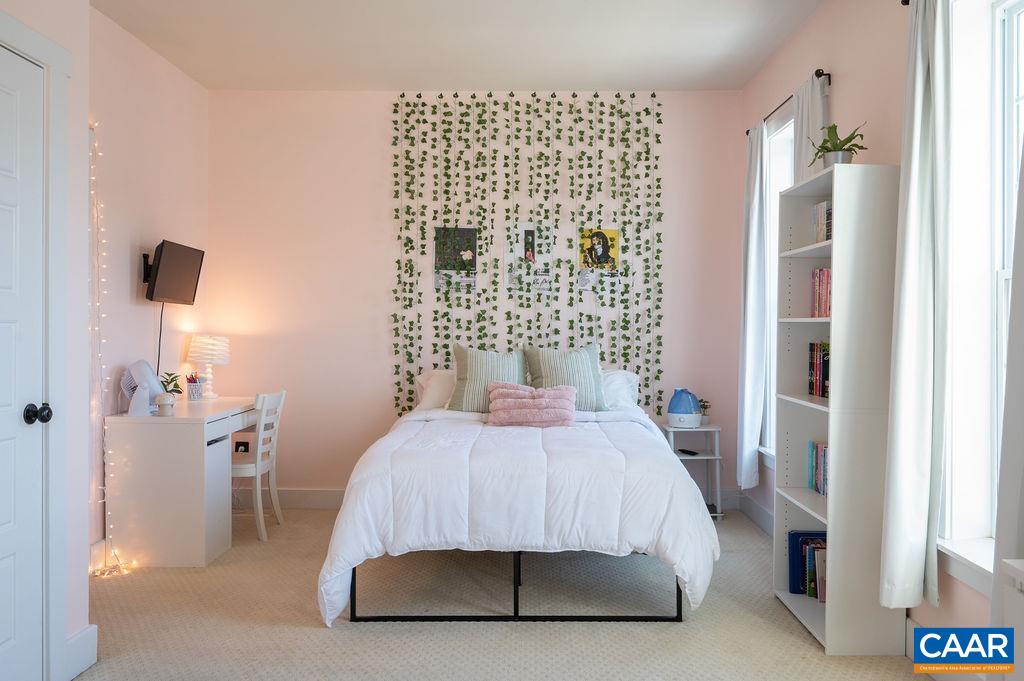 2052 Avinity Loop Charlottesville, VA 22902 - Photo 18 of 39 a bedroom with a bed and a lamp next to a window