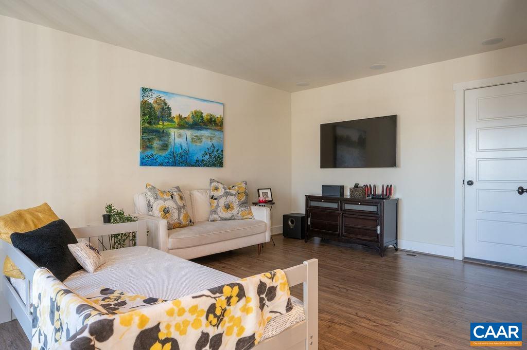 2052 Avinity Loop Charlottesville, VA 22902 - Photo 23 of 39 a living room with furniture and a flat screen tv