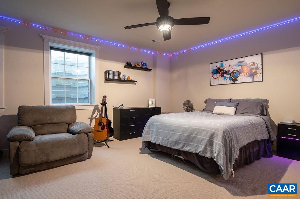 2052 Avinity Loop Charlottesville, VA 22902 - Photo 26 of 39 a spacious bedroom with a bed and window
